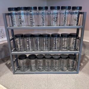 Spice Rack with Glass Jars and Black Lids